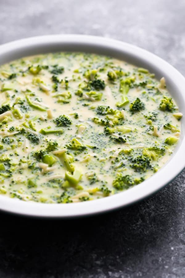 crustless broccoli quiche in pie plate before baking