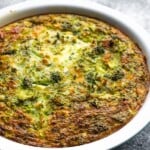 Broccoli cheese crustless quiche in a large white pie plate