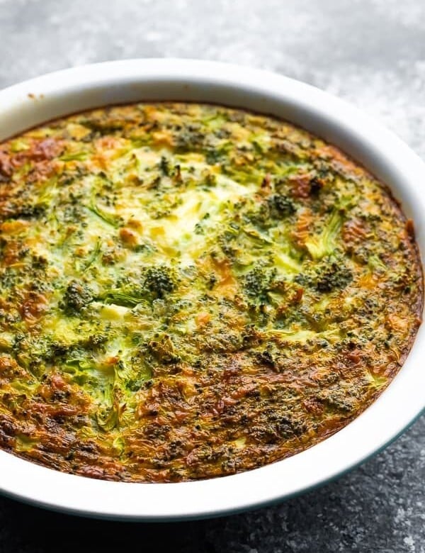 Broccoli cheese crustless quiche in a large white pie plate