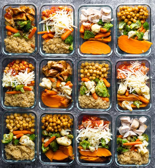 12 meal prep containers filled with cooked meals