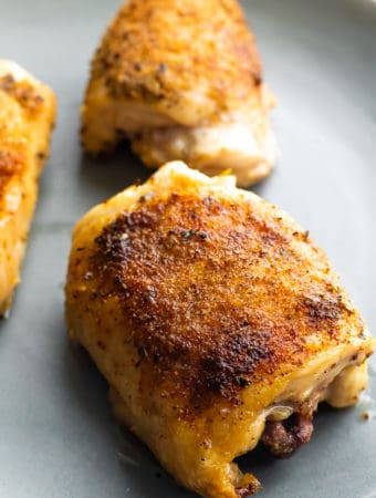 crispy baked chicken thighs on a sheet pan