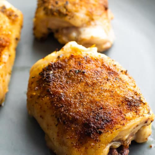 crispy baked chicken thighs on a sheet pan