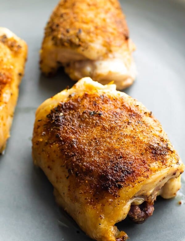 crispy baked chicken thighs on a sheet pan