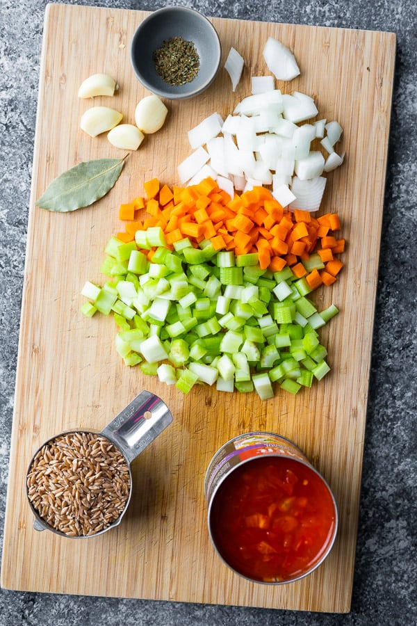 ingredients for sausage soup with farro on cutting board