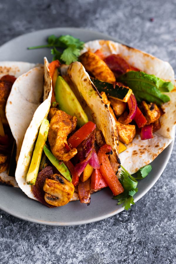 close up view of easy chicken fajitas recipe on plate