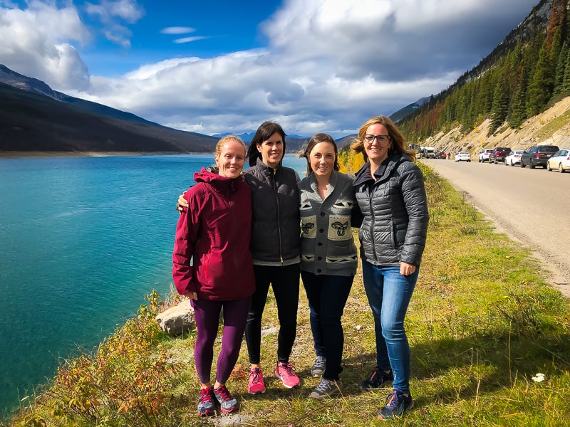 Denise and three other women next to a lake