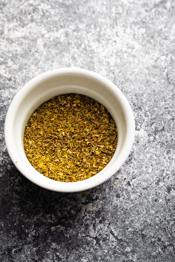 lemon herb seasoning in white bowl for the sheet pan salmon