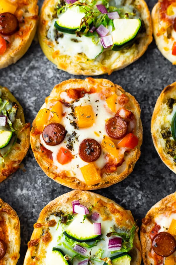 overhead view of english muffin pizza on table