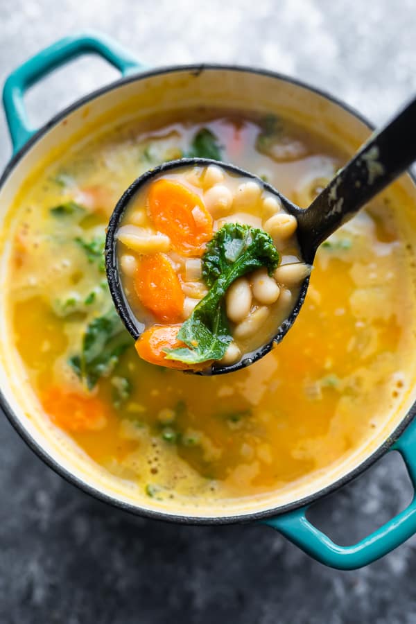 overhead view of kale soup recipe on ladle