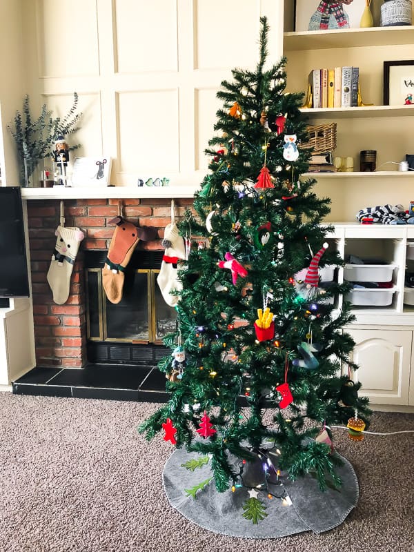 christmas tree with stockings in background