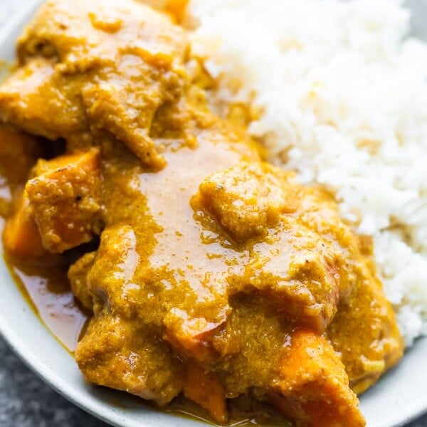close up shot of chicken korma with sweet potato and rice