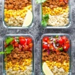 overhead shot of four containers filled with turkey taco meal prep bowls