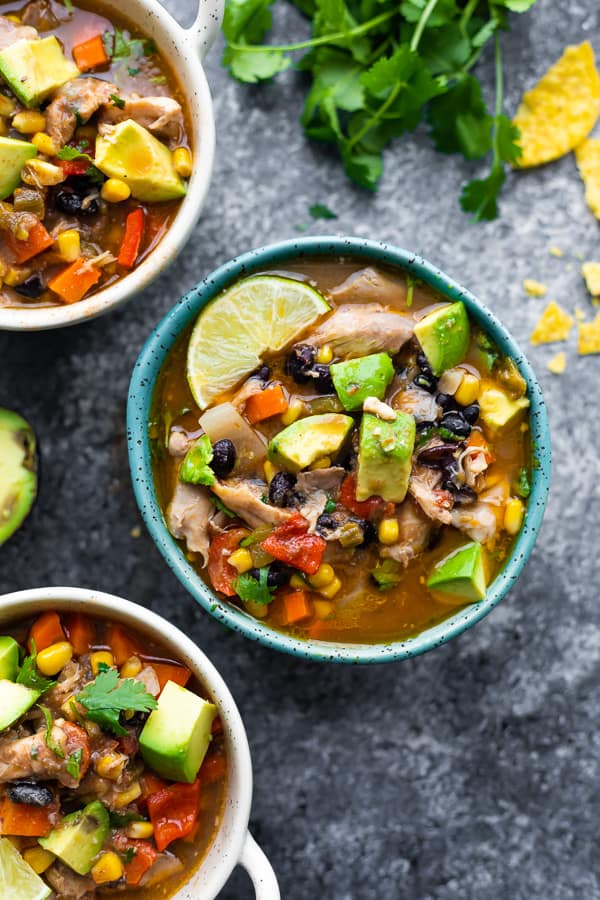 overhead view of mexican chicken stew in blue bowl