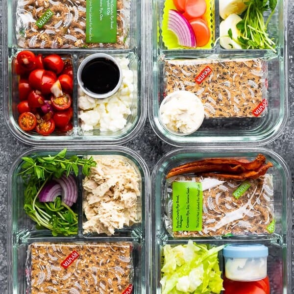 overhead shot of glass meal prep containers with 4 bento lunch box ideas