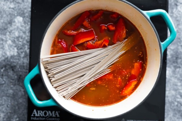 cooking the thai curry soup in a pot