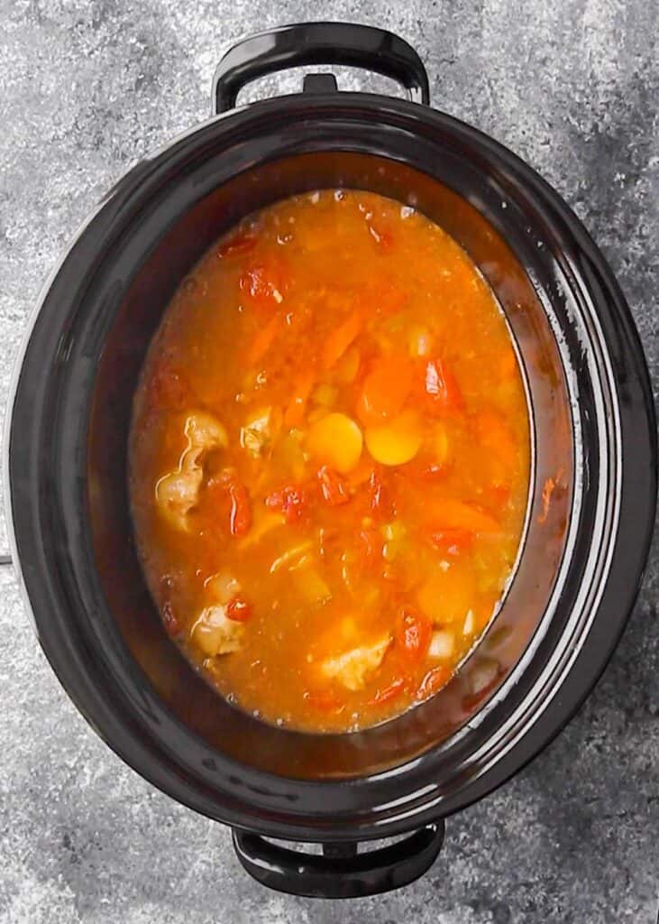 overhead shot of slow cooker tuscan chicken stew in a slow cooker