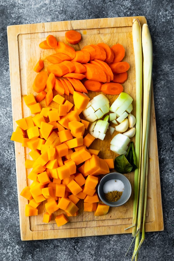 ingredients required for this vegan butternut squash soup on cutting board
