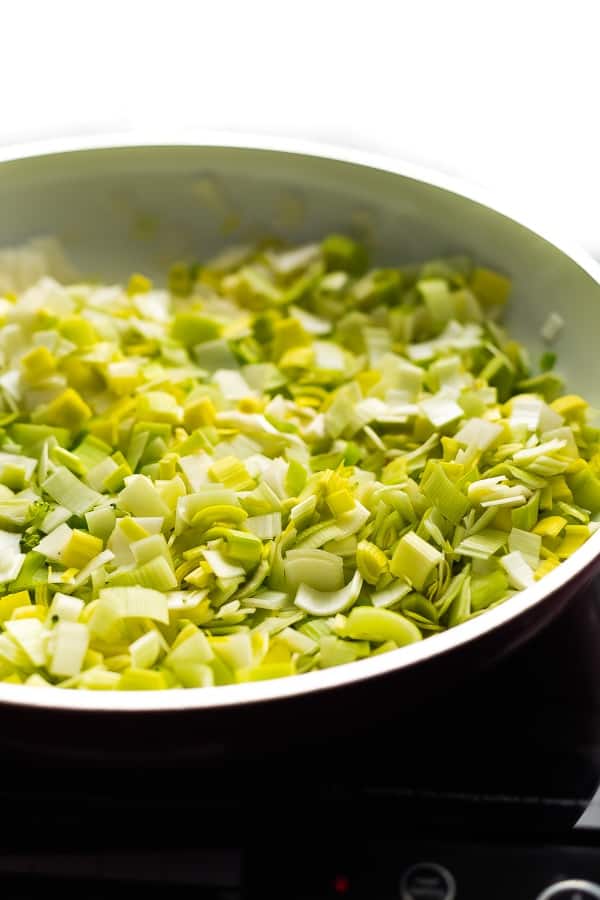 sauteeing leeks for the vegan broccoli soup in pan