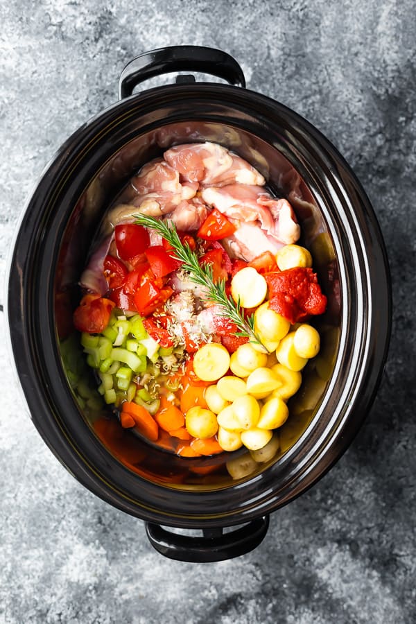 overhead shot of slow cooker tuscan chicken stew in a slow cooker