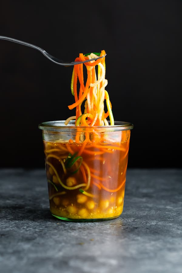fork pulling noodles out of a healthy cup of noodles