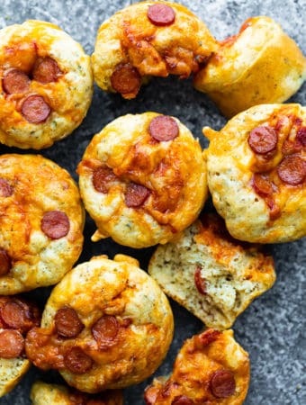 overhead shot of many cheesy pepperoni pizza puffs