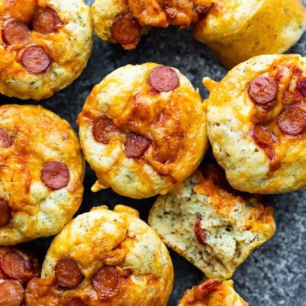 overhead shot of many cheesy pepperoni pizza puffs