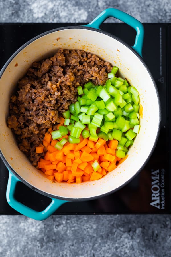 cooking the Sausage and White Bean Soup in a pot on a hot plate