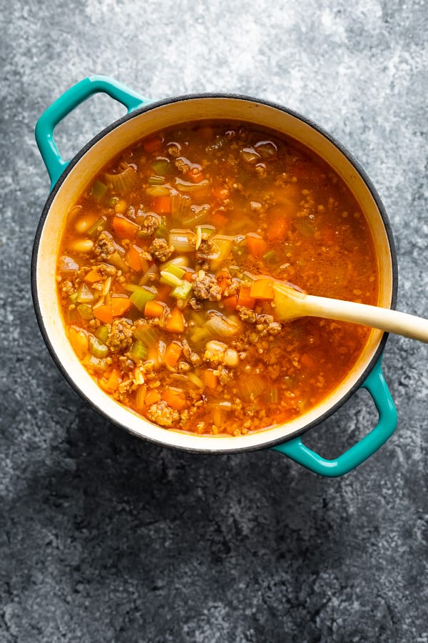 sausage white bean soup in pot after cooking.