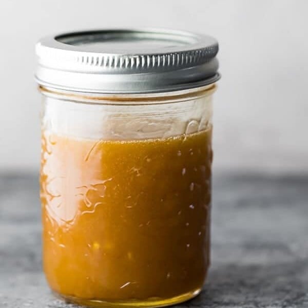 5 minute asian salad dressing in a mason jar on gray background