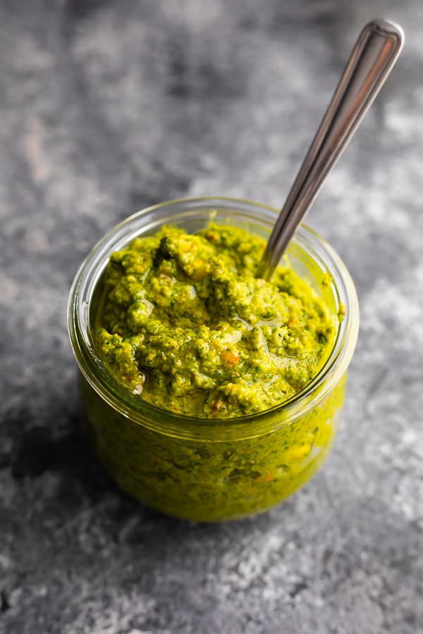 mint and pistachio pesto in canning jar with spoon