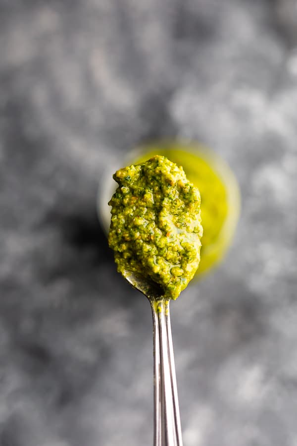 Close up shot of mint and pistachio pesto on a spoon