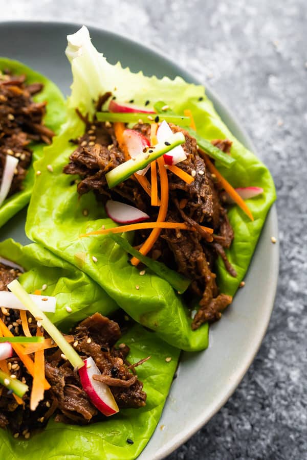 Korean beef lettuce wraps on a gray plate
