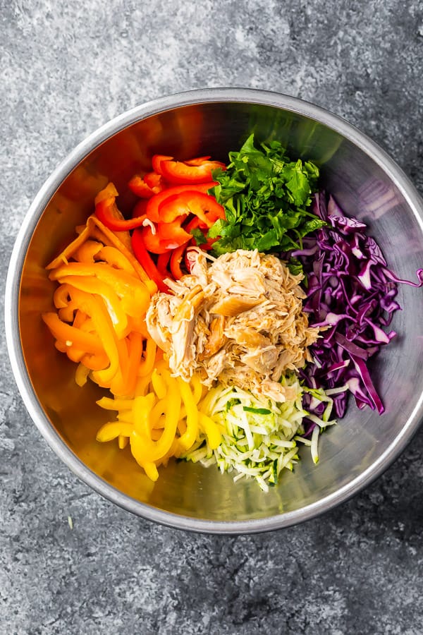 ingredients for soba noodle salad in a bowl before tossing