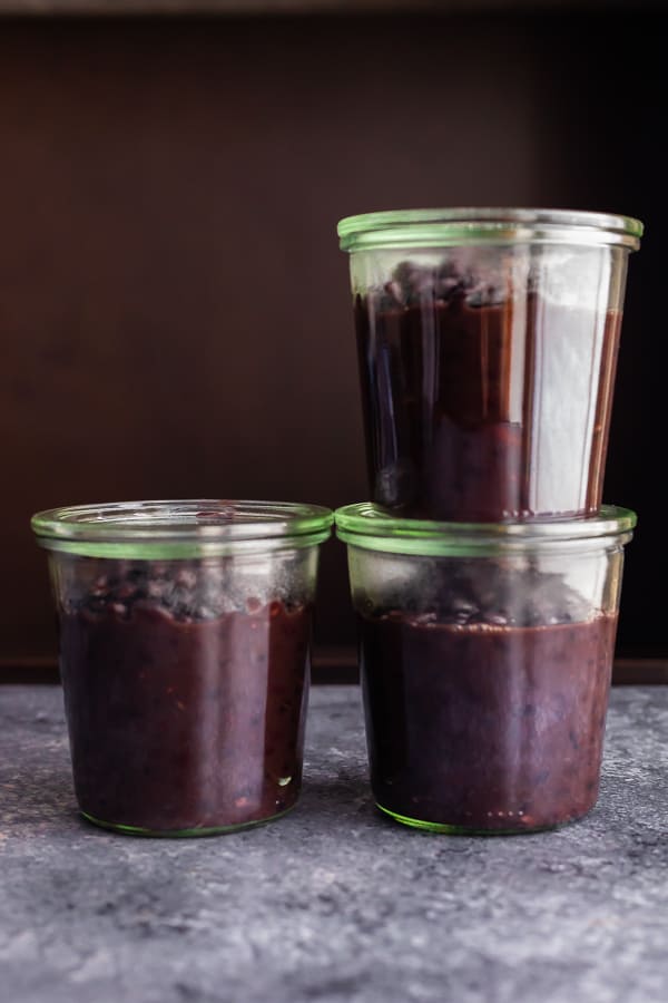 stacked jars full of black beans