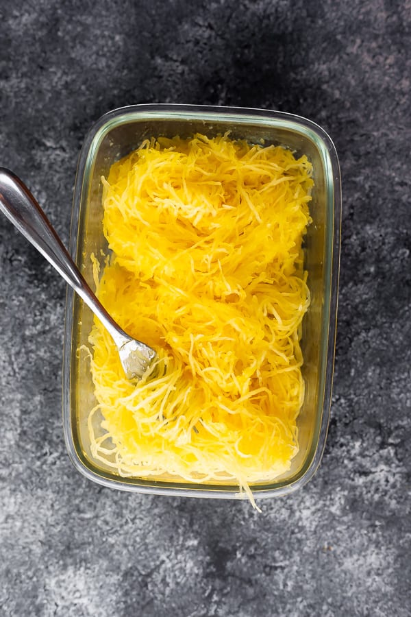 cooked spaghetti squash in a meal prep container