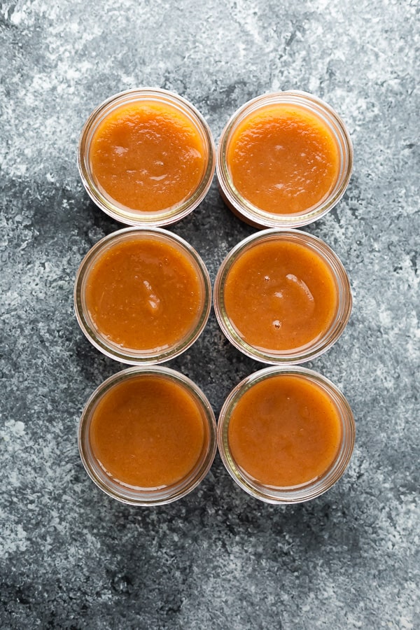 overhead view of 6 jars of instant pot applesauce for meal prep