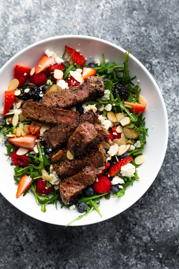 Strawberry Steak Salad in white bowl