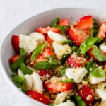 close up side angle shot of strawberry caprese quinoa salad
