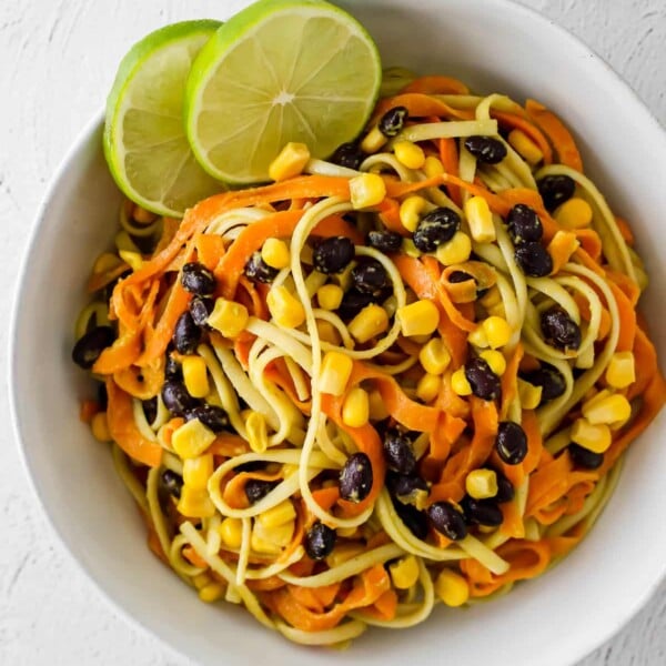 overhead shot of sweet potato noodles with avocado sauce in a bowl