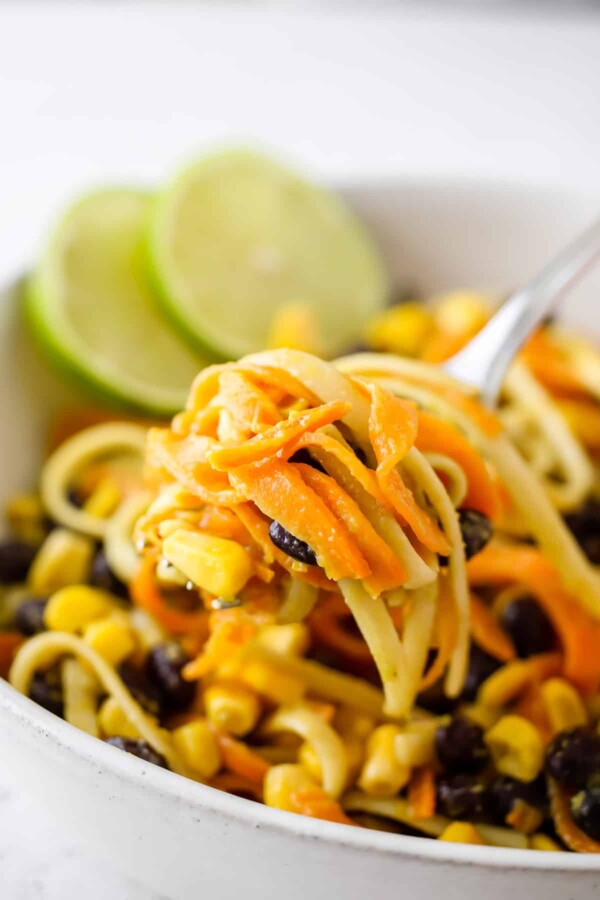 close up shot of sweet potato noodles on a fork