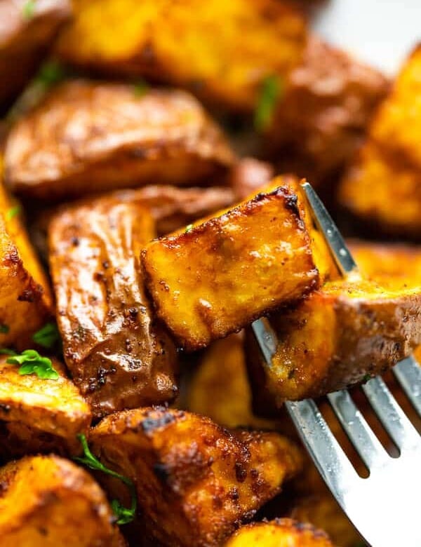 close up view of air fryer roasted potatoes on fork