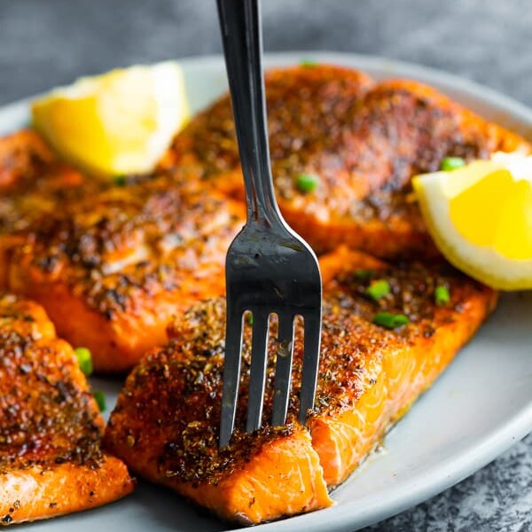 fork flaking into a portion of air fryer salmon