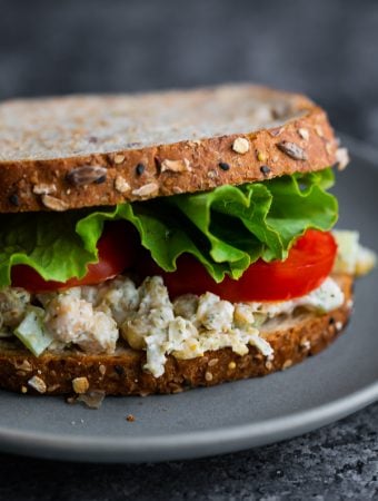 close up view of chickpea salad sandwich on plate
