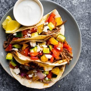 overhead shot of honey garlic beef tacos on plate