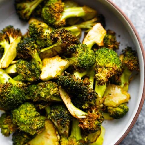 close up shot of air fryer broccoli in a bowl