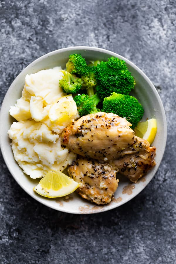 lemon garlic chicken on plate with mashed potatoes and broccoli