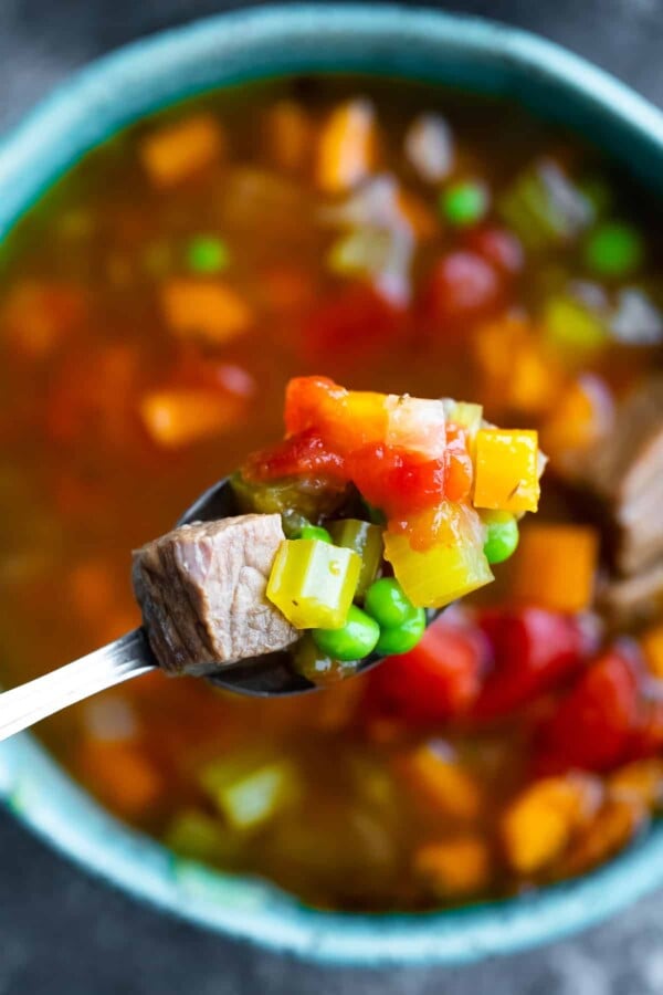 instant pot beef vegetable soup on a spoon