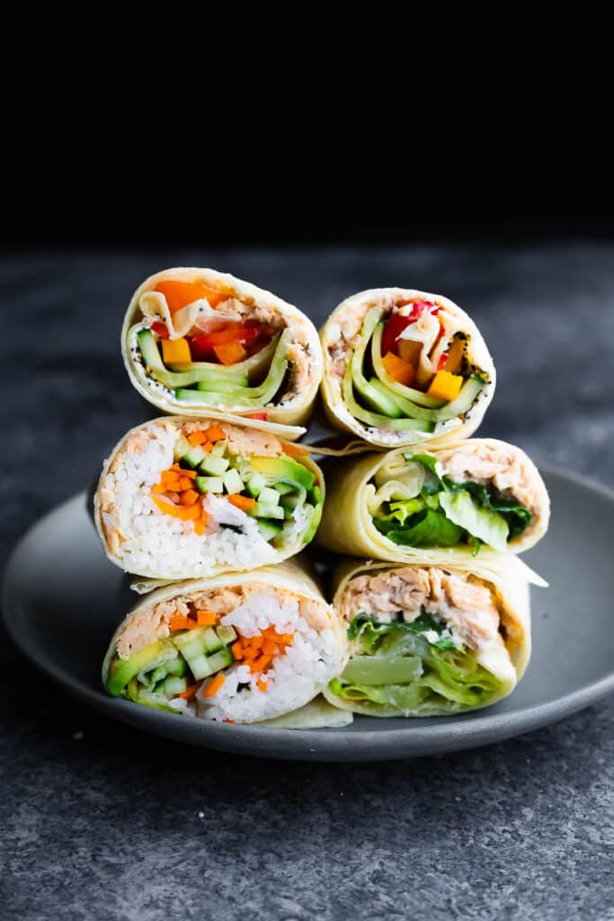 stack of 6 wraps on plate with fillings exposed