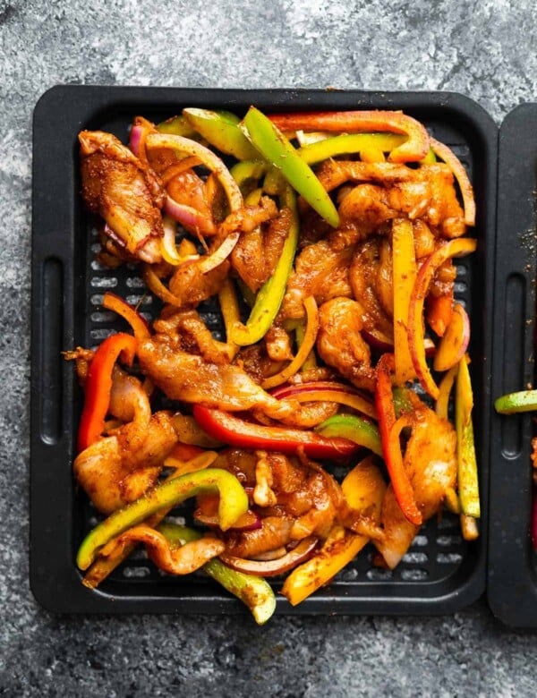 air fryer chicken fajitas on tray before cooking