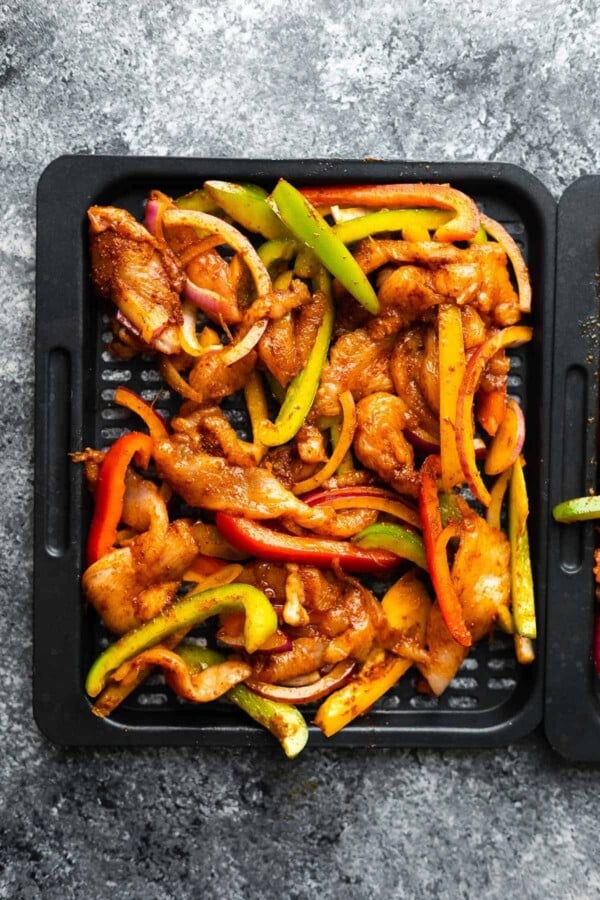 air fryer chicken fajitas on tray before cooking